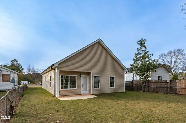 a view of a yard with basketball court
