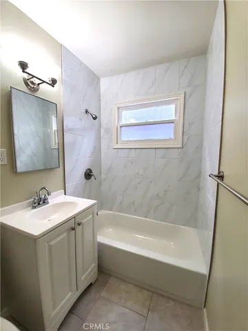 a kitchen with a refrigerator and cabinets