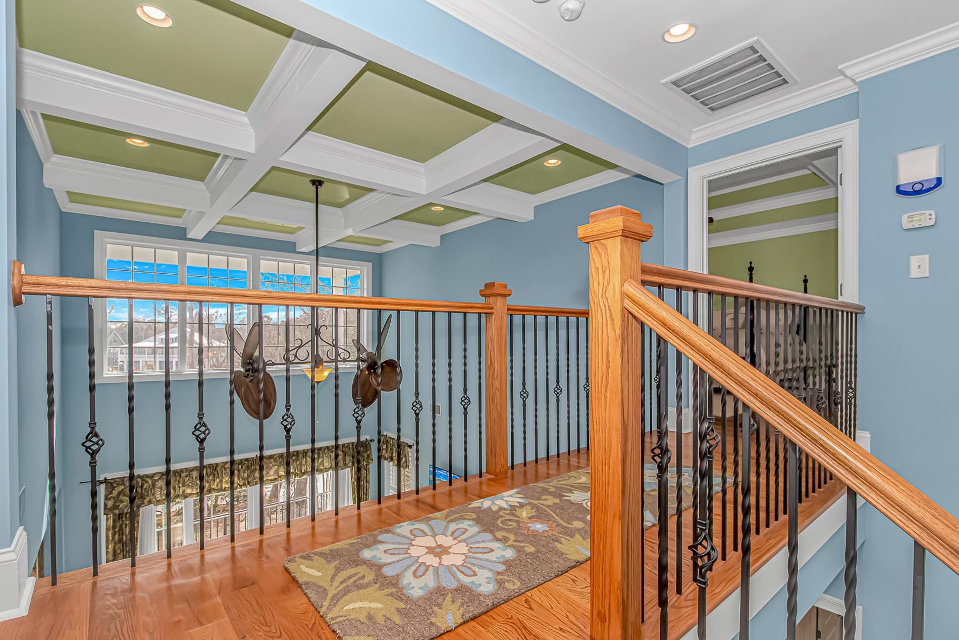 309 North Myrtle Drive Surfside Beach, SC 29575 - Photo 15 of 40 Hall with coffered ceiling, beam ceiling, recessed lighting, wood finished floors, and crown molding