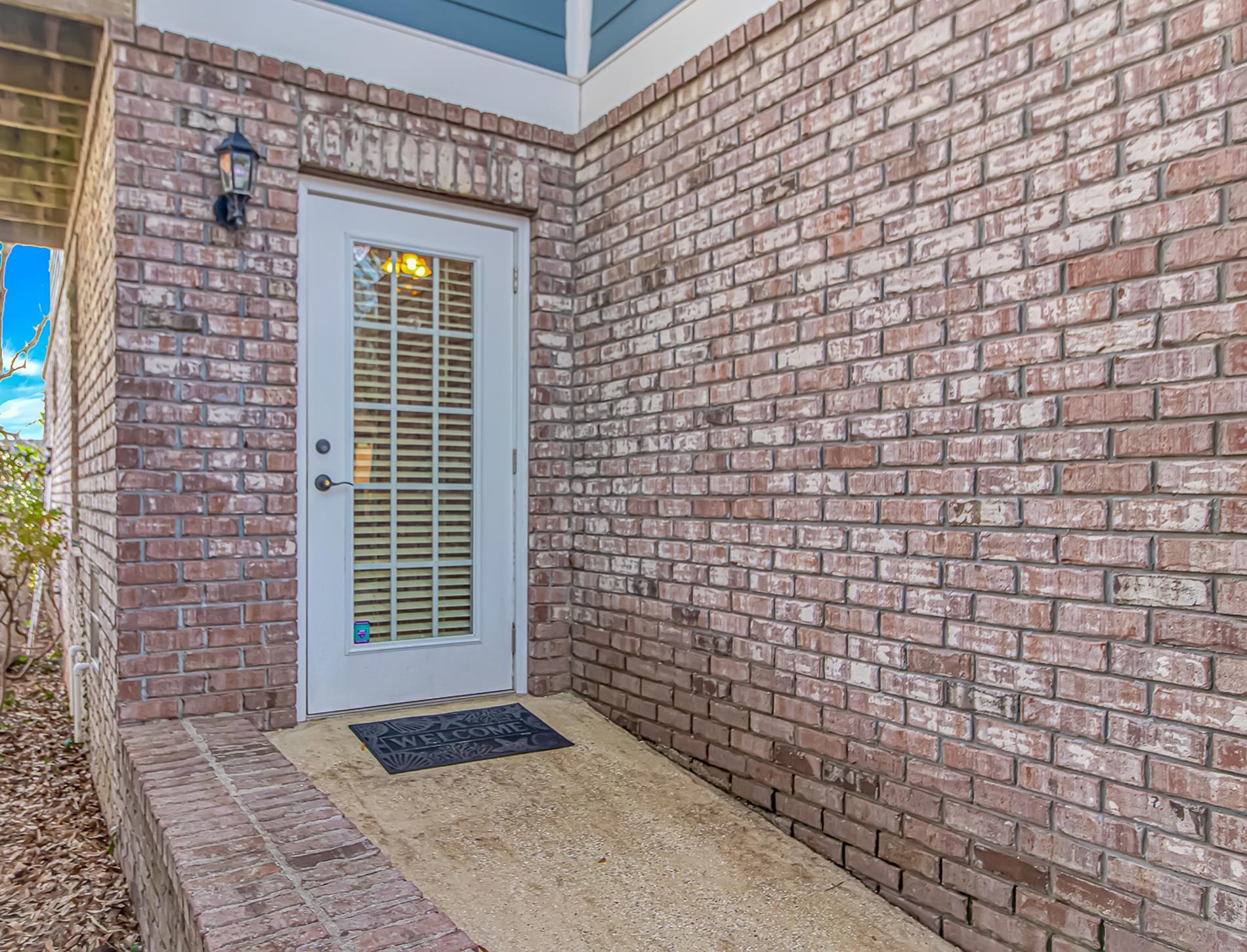 309 North Myrtle Drive Surfside Beach, SC 29575 - Photo 26 of 40 Entrance to property with brick siding and a patio area