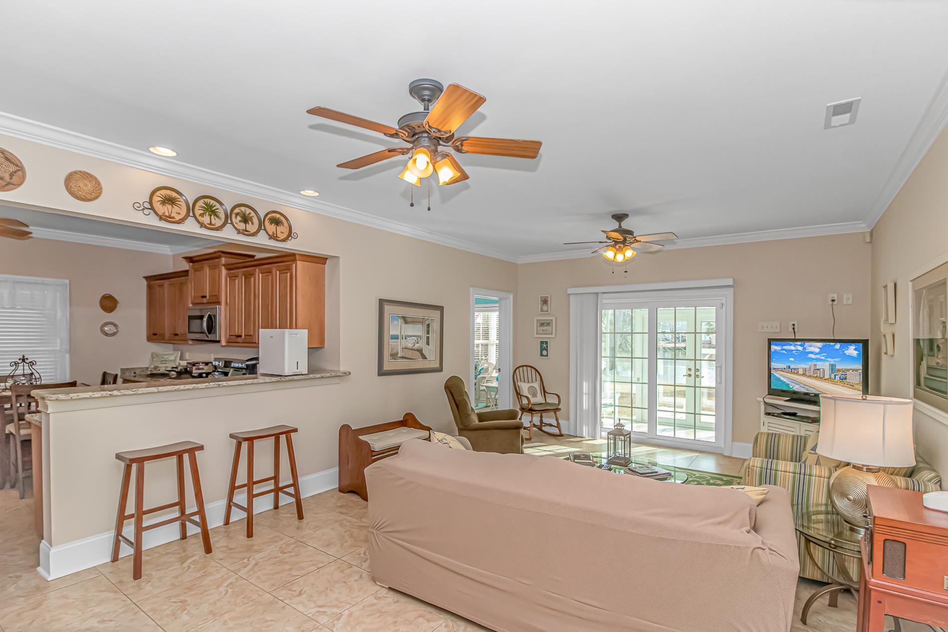 309 North Myrtle Drive Surfside Beach, SC 29575 - Photo 27 of 40 Living area with a ceiling fan, ornamental molding, and light tile patterned floors