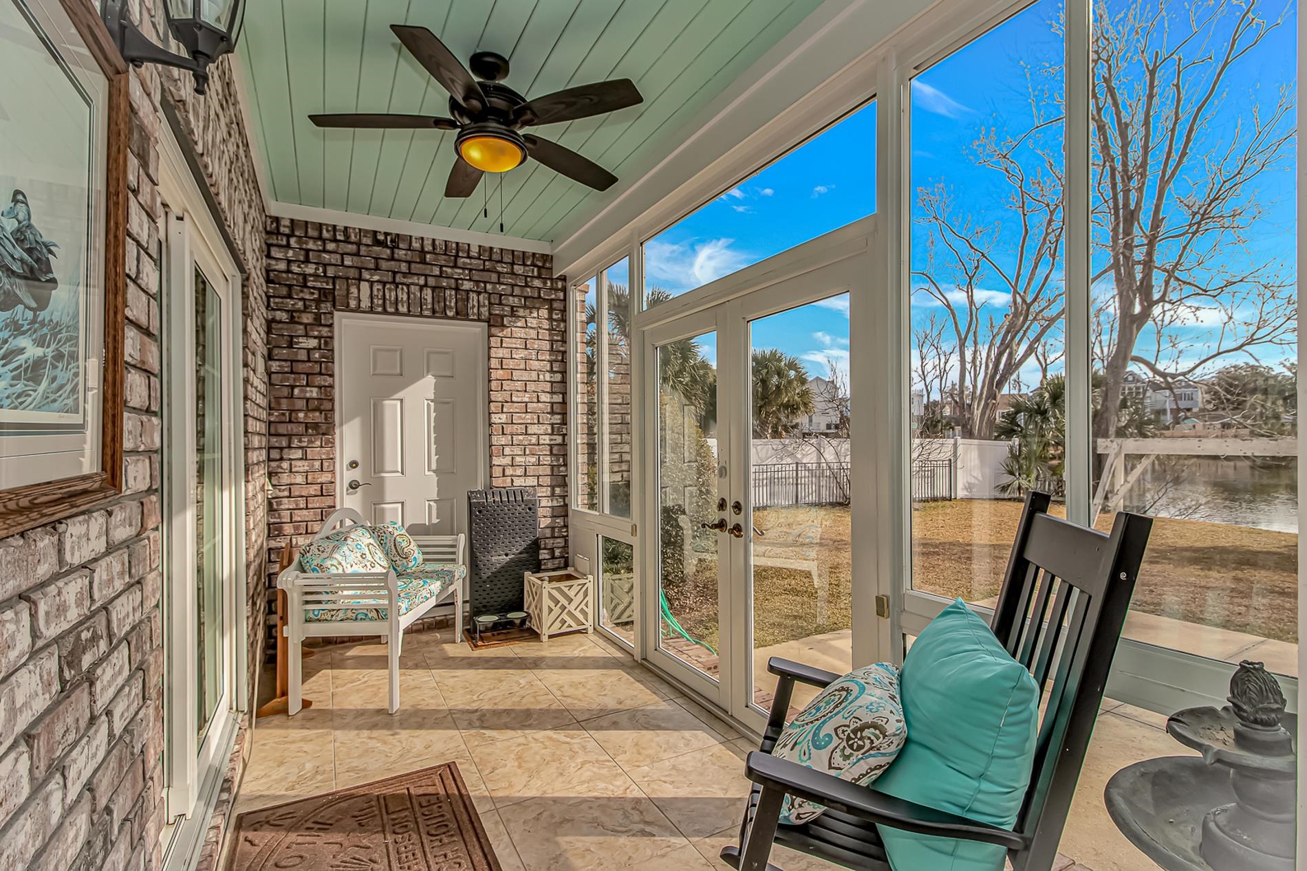 309 North Myrtle Drive Surfside Beach, SC 29575 - Photo 32 of 40 Sunroom / solarium with a ceiling fan, a water view, and french doors