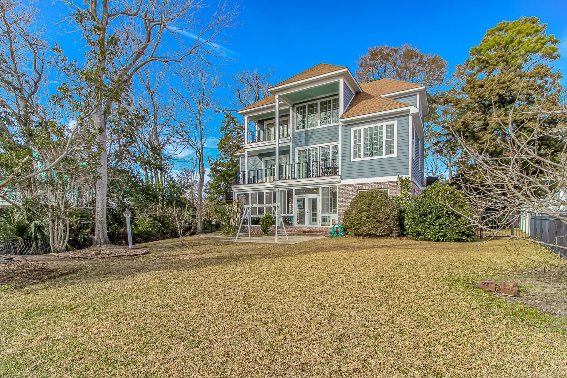309 North Myrtle Drive Surfside Beach, SC 29575 - Photo 36 of 40 Back of house with a balcony, roof with shingles, french doors, brick siding, and a patio area