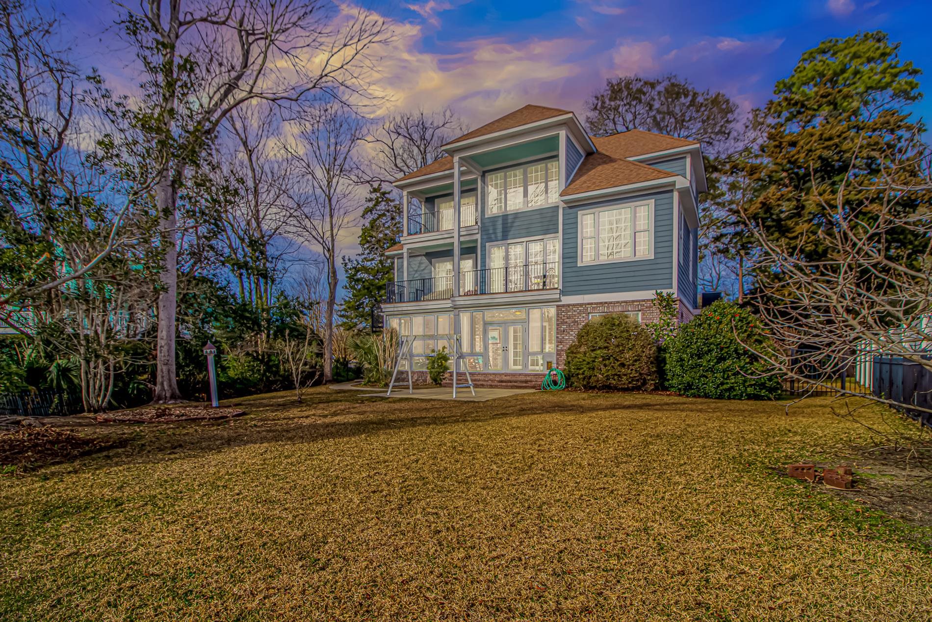 309 North Myrtle Drive Surfside Beach, SC 29575 - Photo 38 of 40 View of front of property with a balcony, a shingled roof, and brick siding