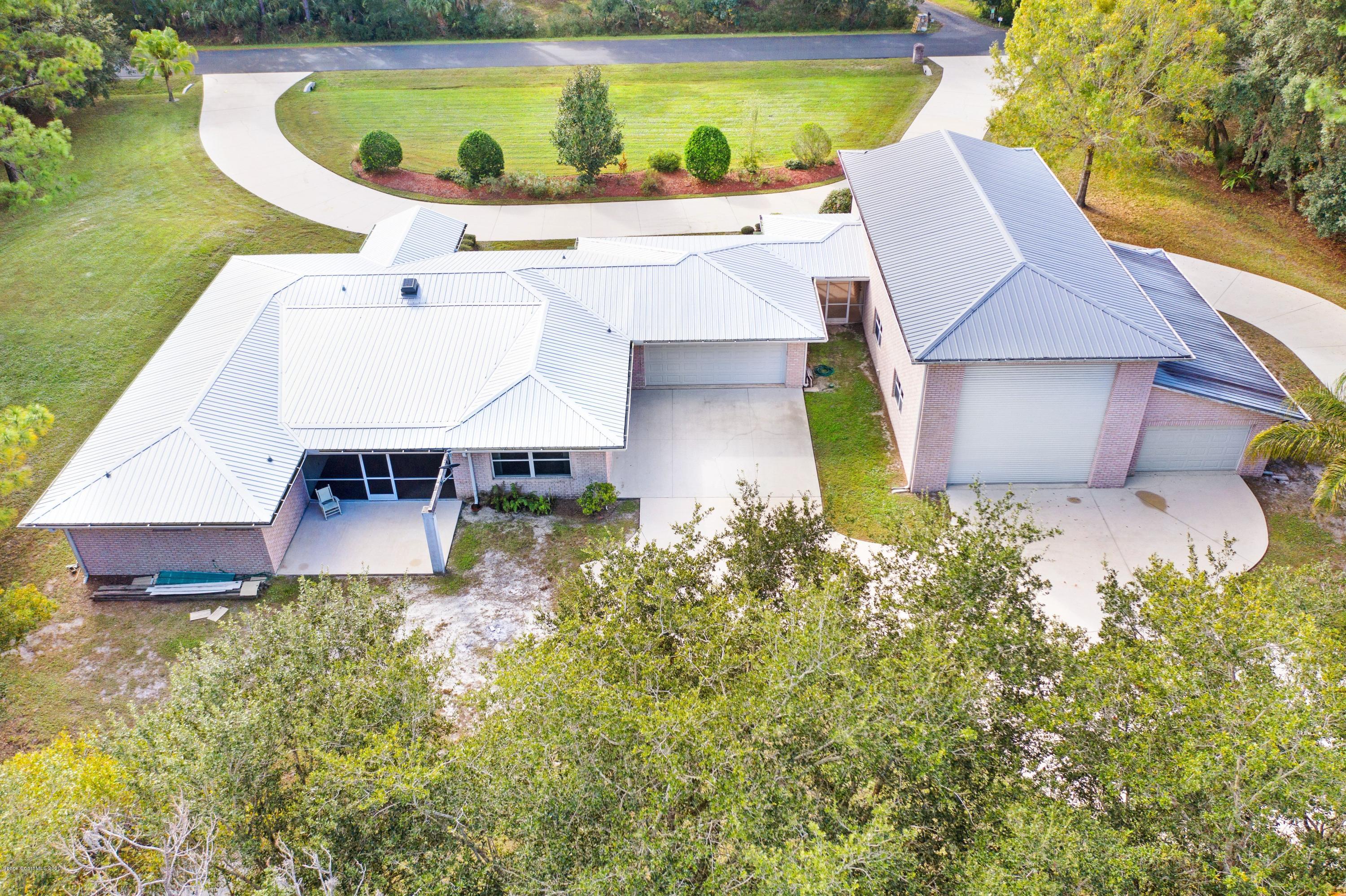 3602 Palomino Road Melbourne, FL 32934 - Photo 3 of 43 Back of Home w/ 3 Garages!