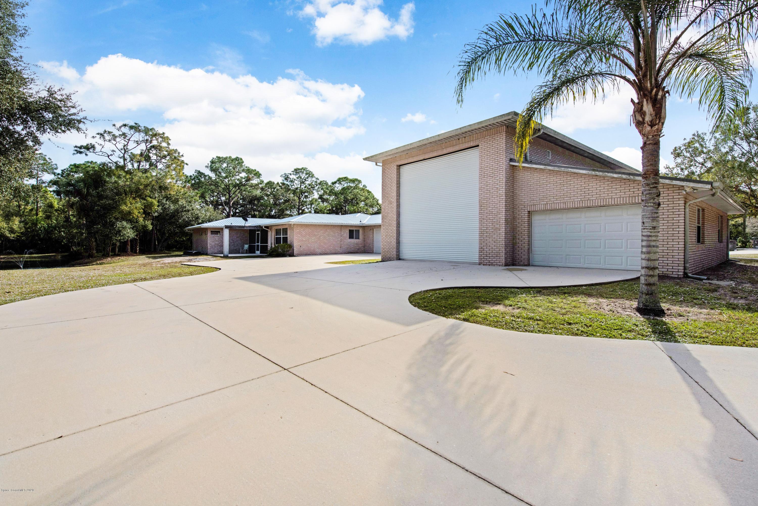 3602 Palomino Road Melbourne, FL 32934 - Photo 29 of 43 2 Garages Open in Front & Back!