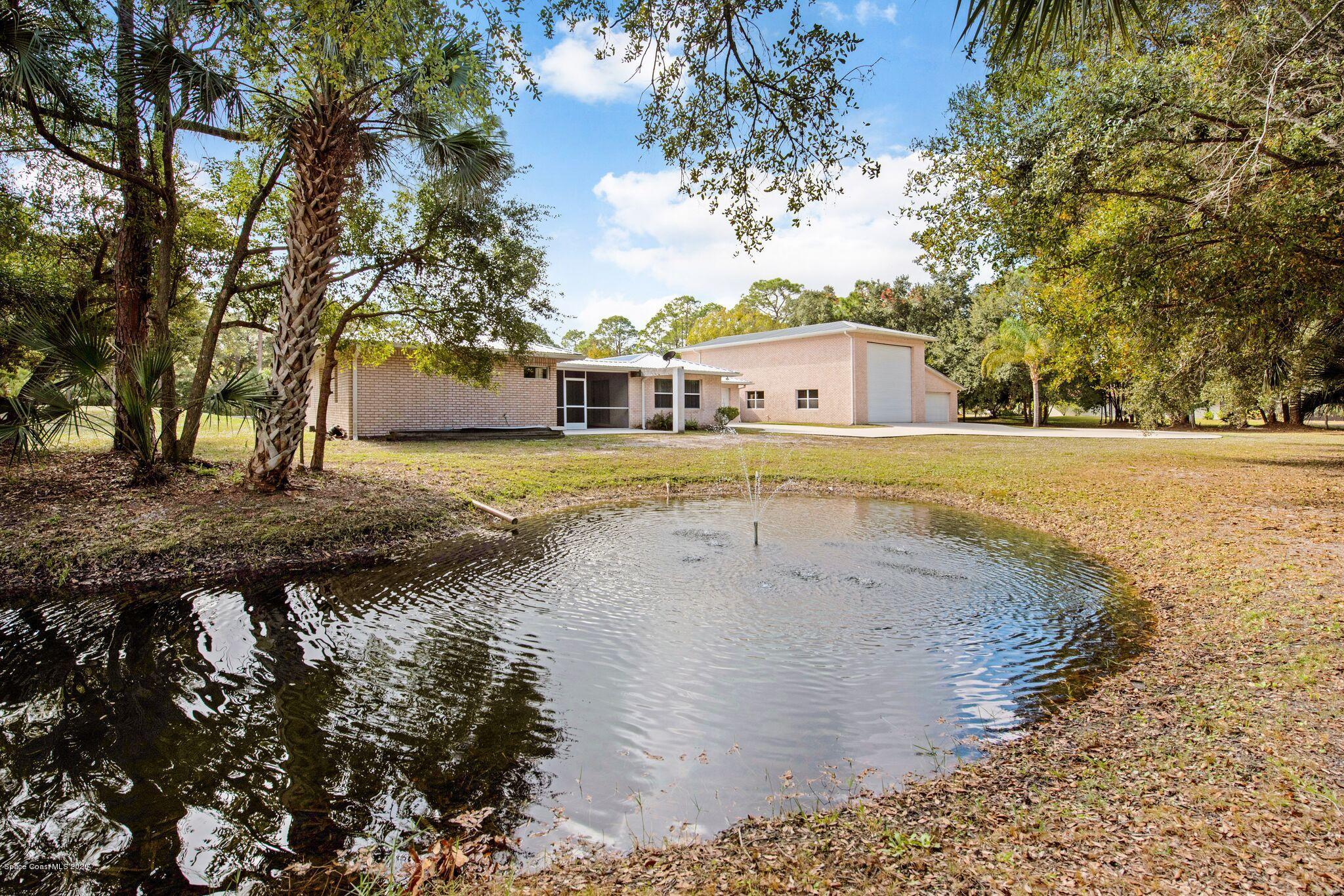 3602 Palomino Road Melbourne, FL 32934 - Photo 4 of 43 Pond Visible from 4 Rooms in the Home