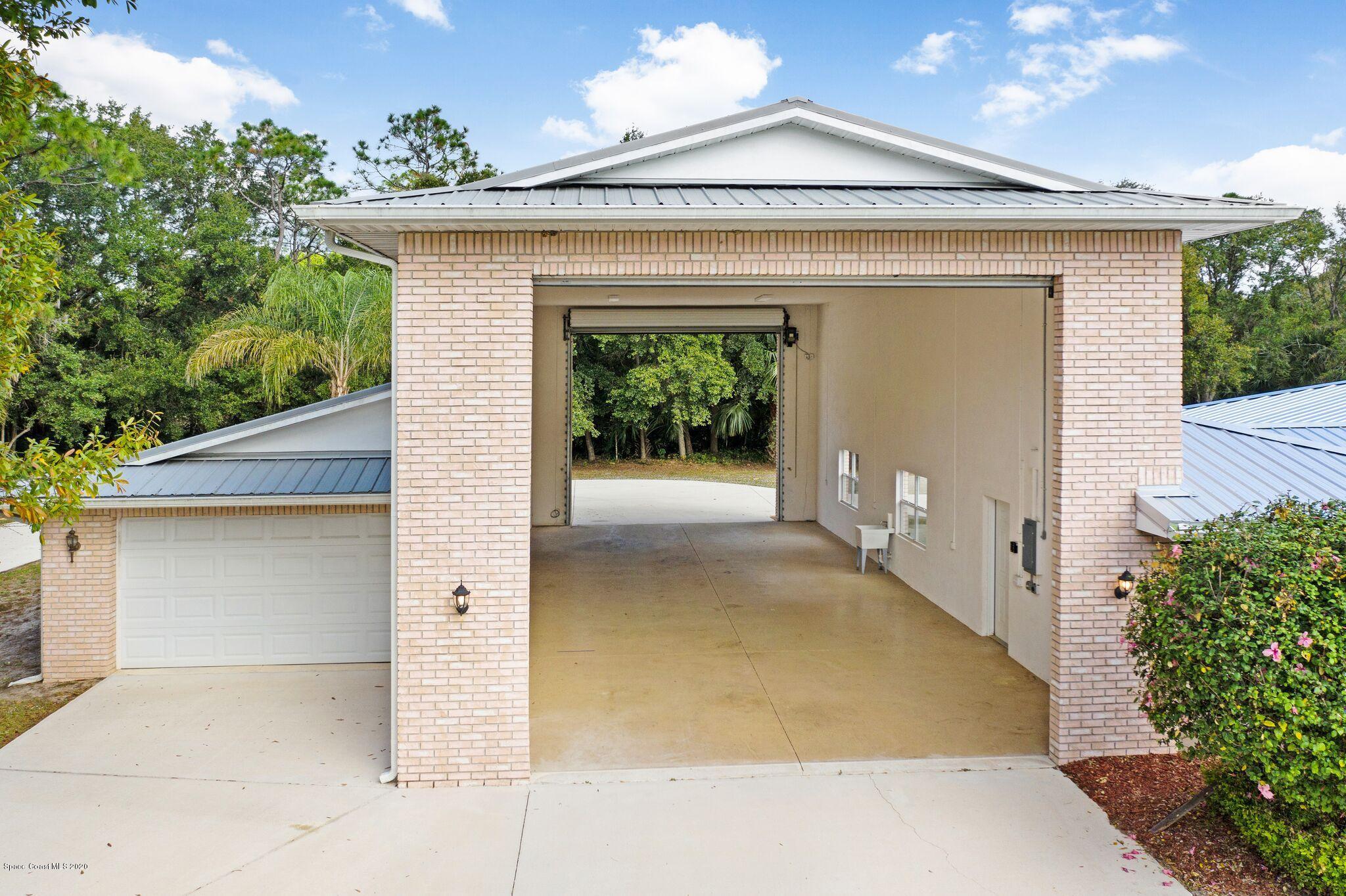 3602 Palomino Road Melbourne, FL 32934 - Photo 5 of 43 55x23 RV garage x/ 40x16 Adjacent Garage