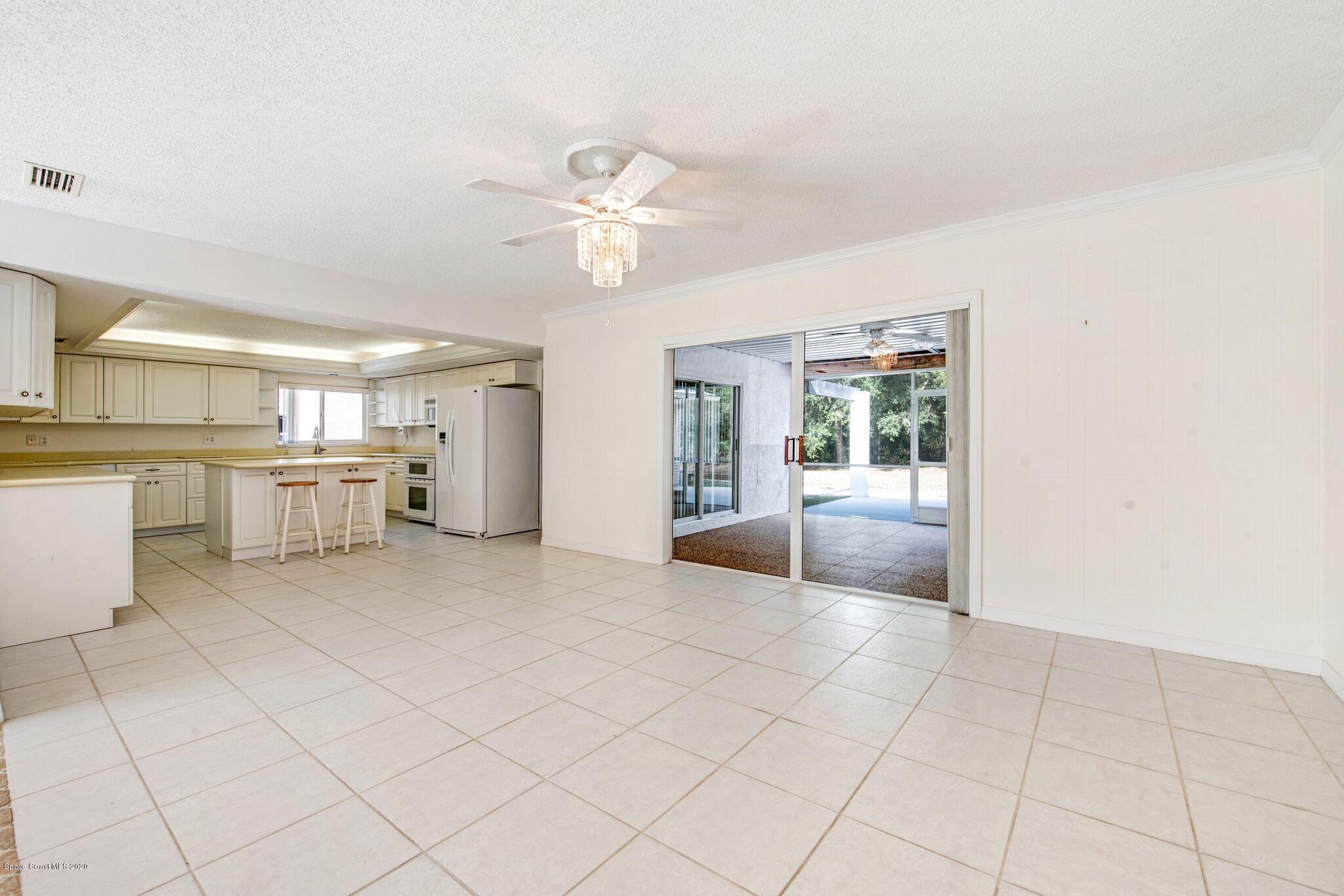 3602 Palomino Road Melbourne, FL 32934 - Photo 10 of 43 Dining Room Into Kitchen