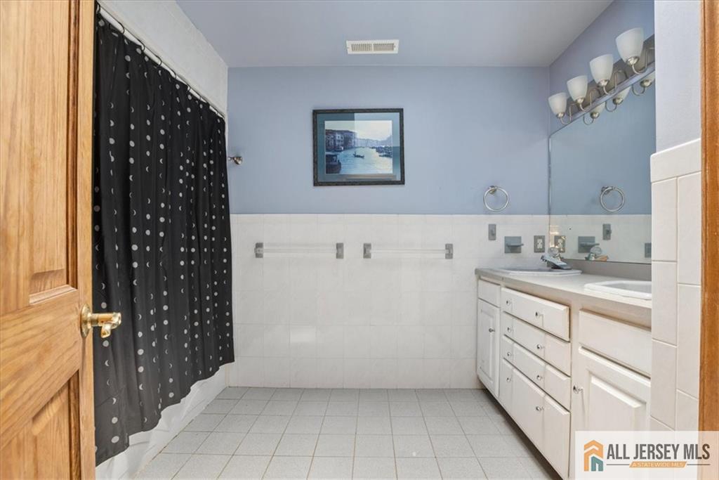 167 Federal Road Monroe Township, NJ 08831 - Photo 30 of 46 a view of cabinets with wooden floor