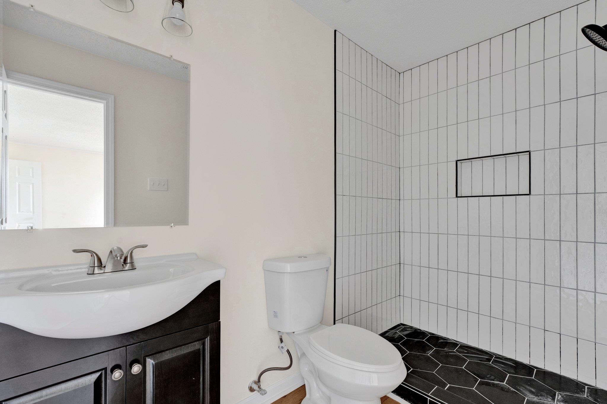 4195 Bishops Bridge Road Memphis, TN 38118 - Photo 14 of 19 a bathroom with a sink toilet and shower