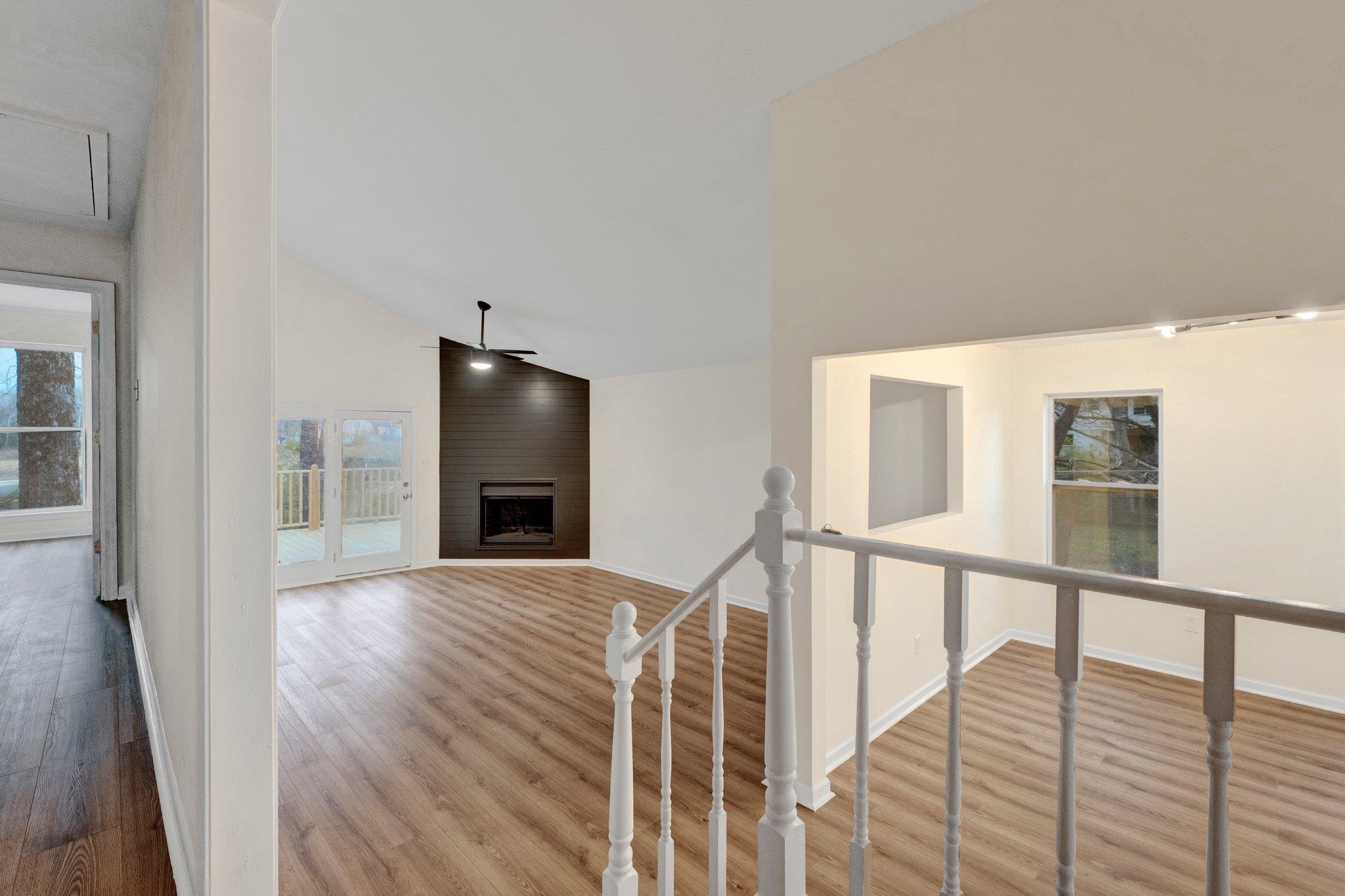 4195 Bishops Bridge Road Memphis, TN 38118 - Photo 3 of 19 a view of an empty room with wooden floor and a window
