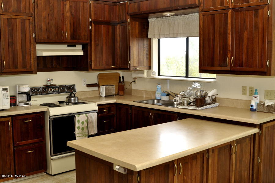 3904-3903 Apache Road Snowflake, AZ 85937 - Photo 3 of 38 a kitchen with a sink a stove and cabinets