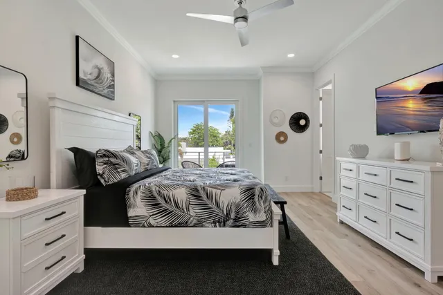 a spacious bedroom with a bed and furniture