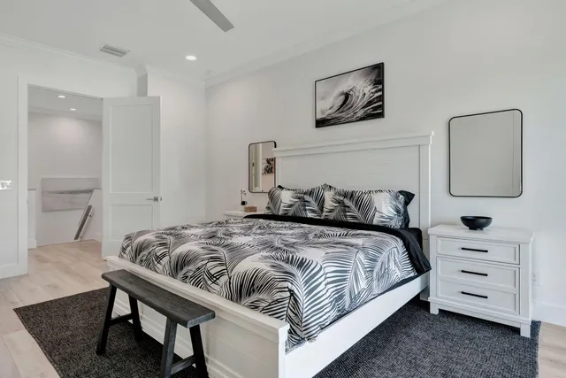 a bedroom with a bed and a dresser