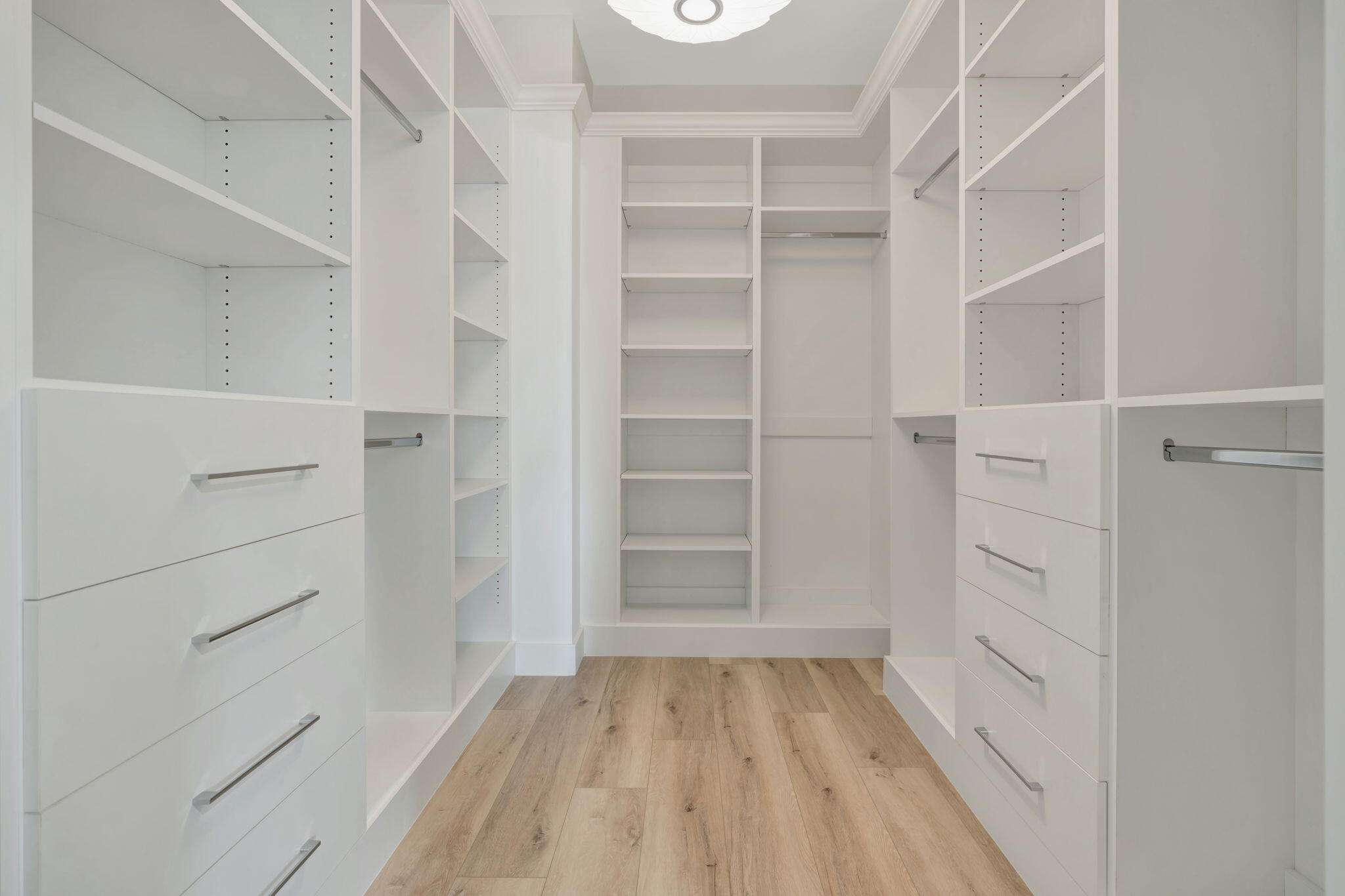 4662 Southeast Manatee Terrace Stuart, FL 34997 - Photo 18 of 32 a view of walk in closet with empty racks