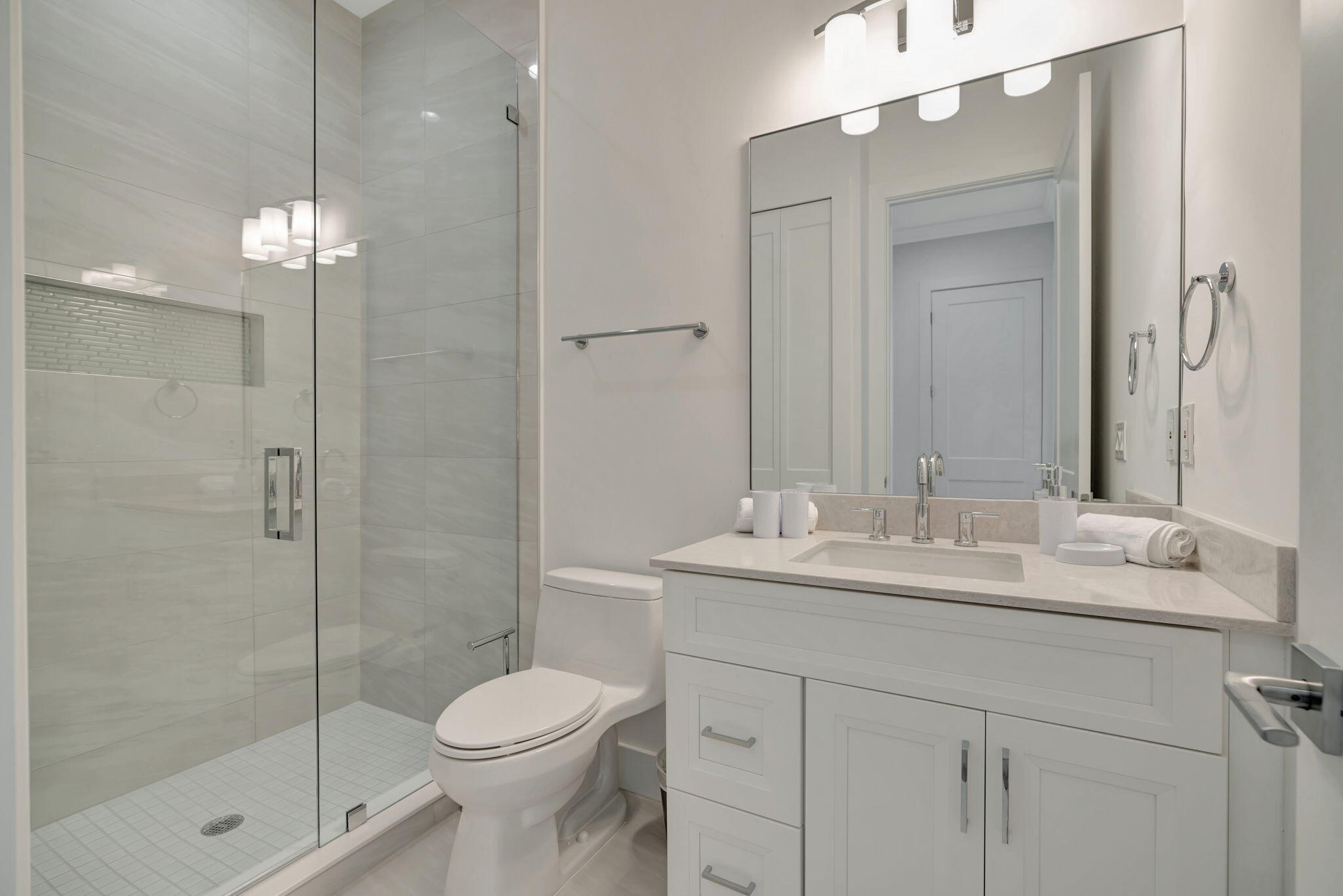 4662 Southeast Manatee Terrace Stuart, FL 34997 - Photo 21 of 32 a bathroom with a sink toilet and shower