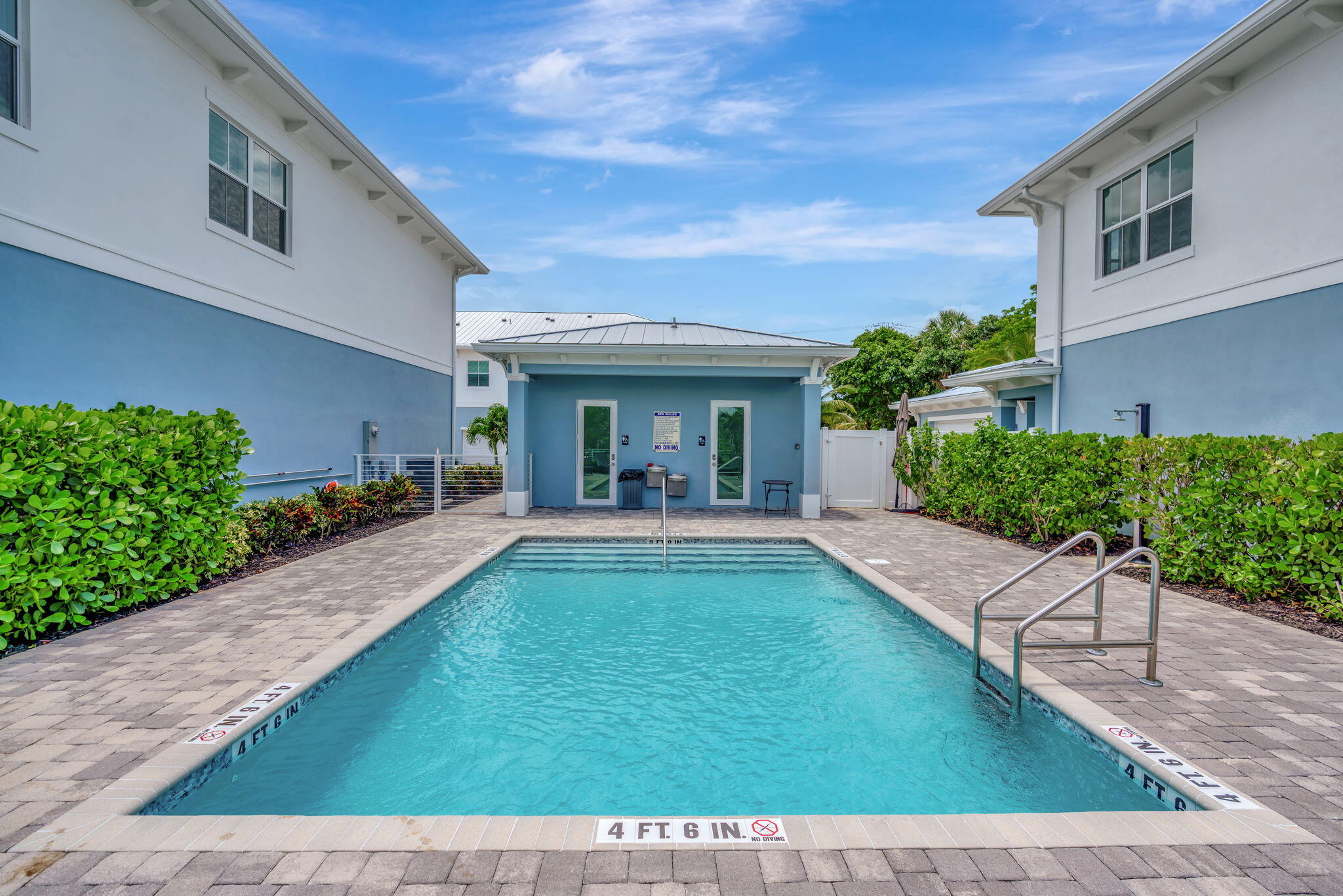 4662 Southeast Manatee Terrace Stuart, FL 34997 - Photo 24 of 32 a view of a house with backyard porch and sitting area