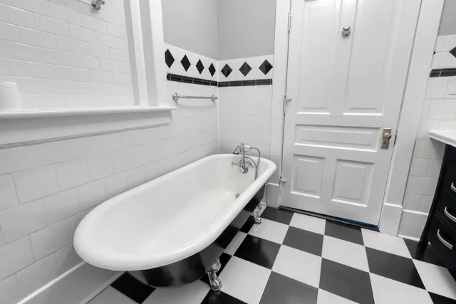 a bathroom with a bathtub and a sink