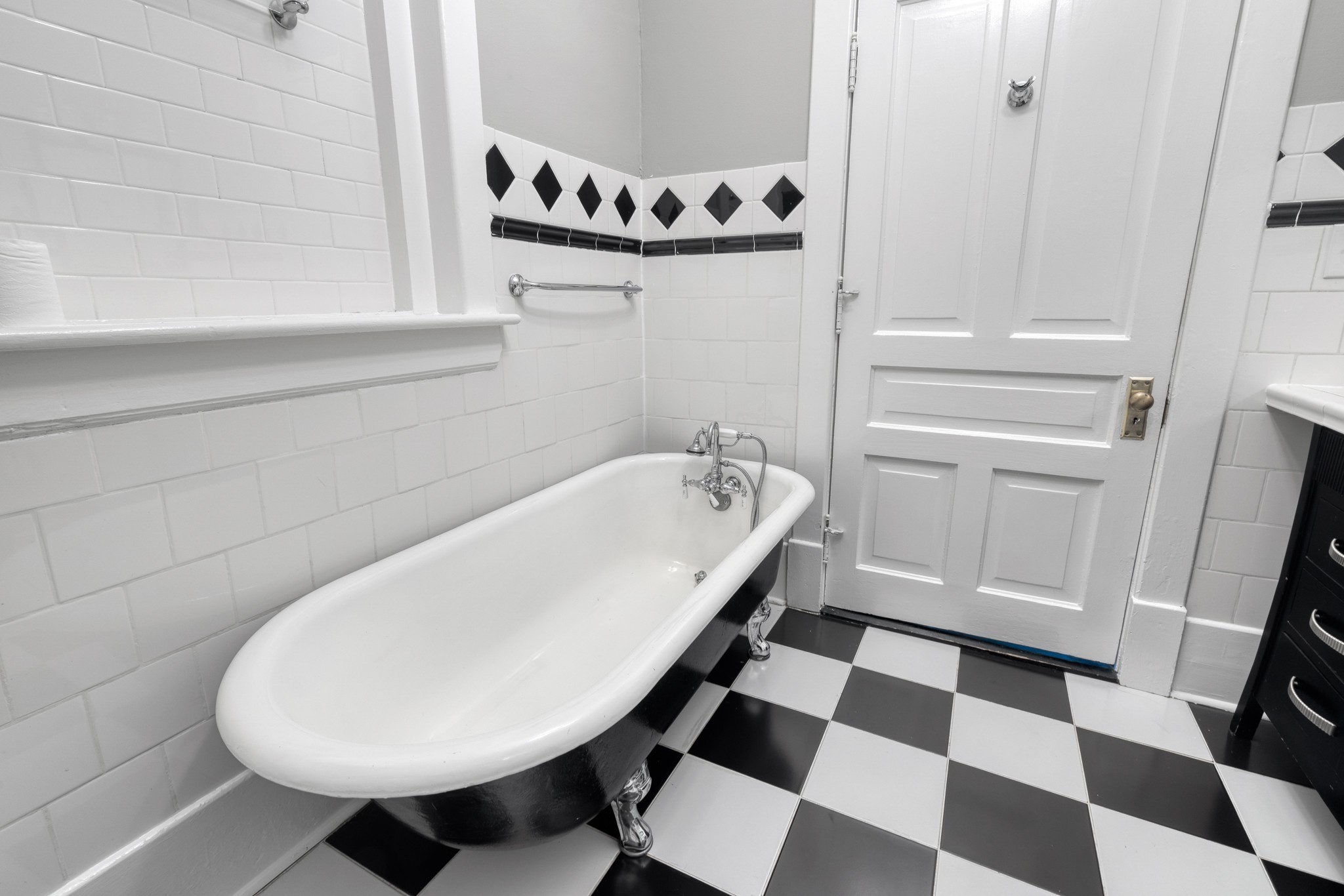 1025 Villa Place Nashville, TN 37212 - Photo 11 of 37 a bathroom with a bathtub and a sink