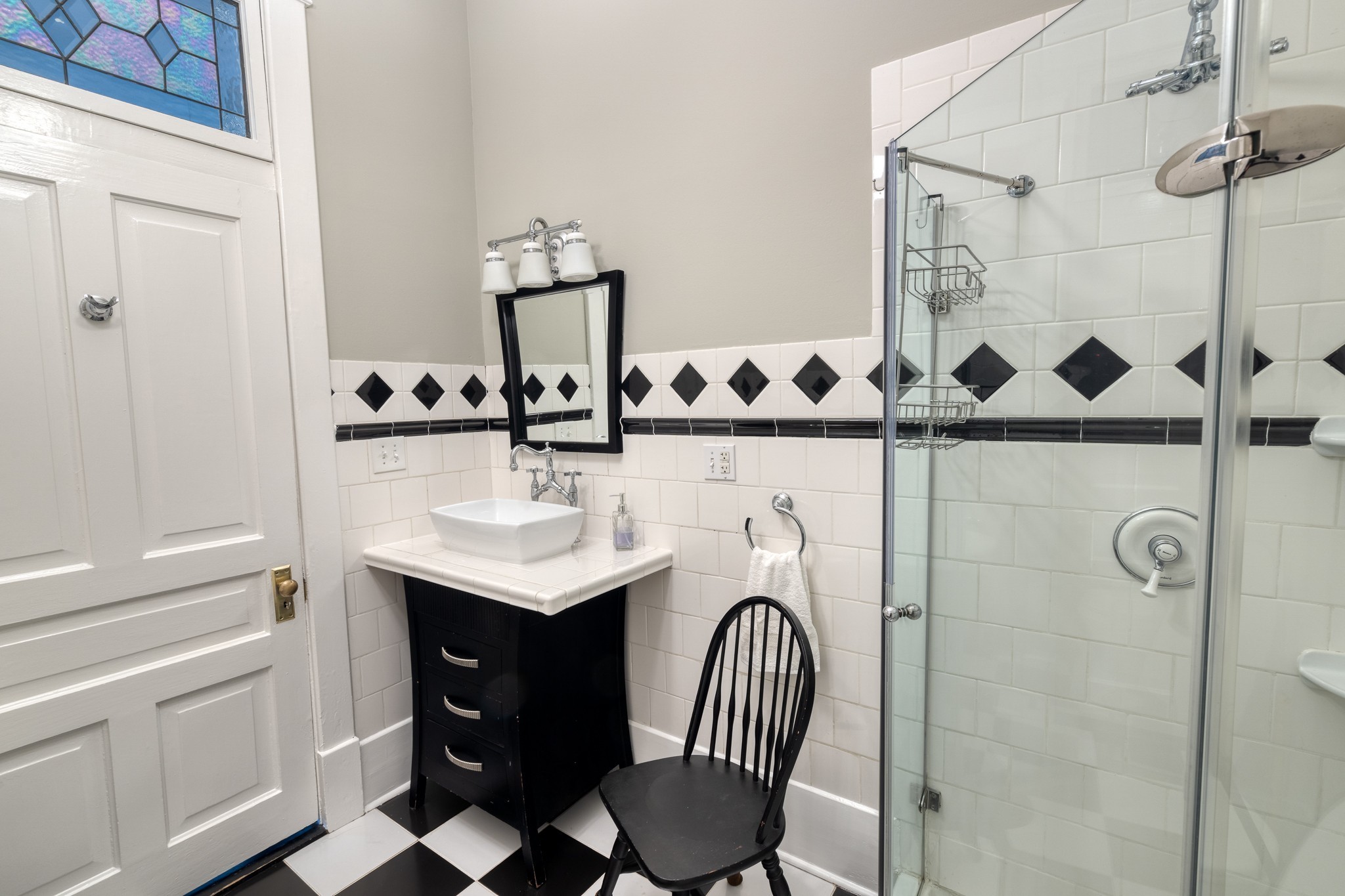 1025 Villa Place Nashville, TN 37212 - Photo 12 of 37 a bathroom with a sink a toilet and shower
