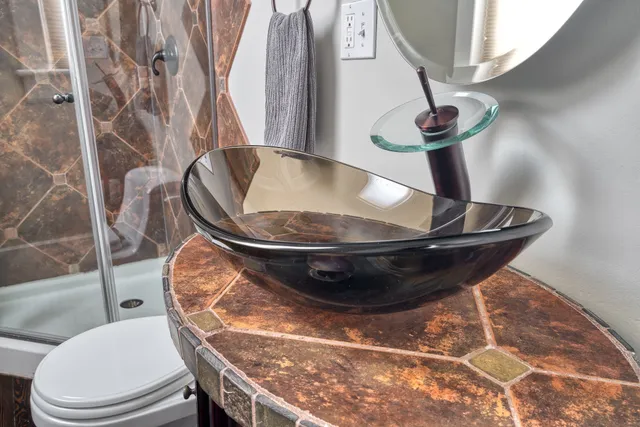 a view of a living room with a bath tub and toilet
