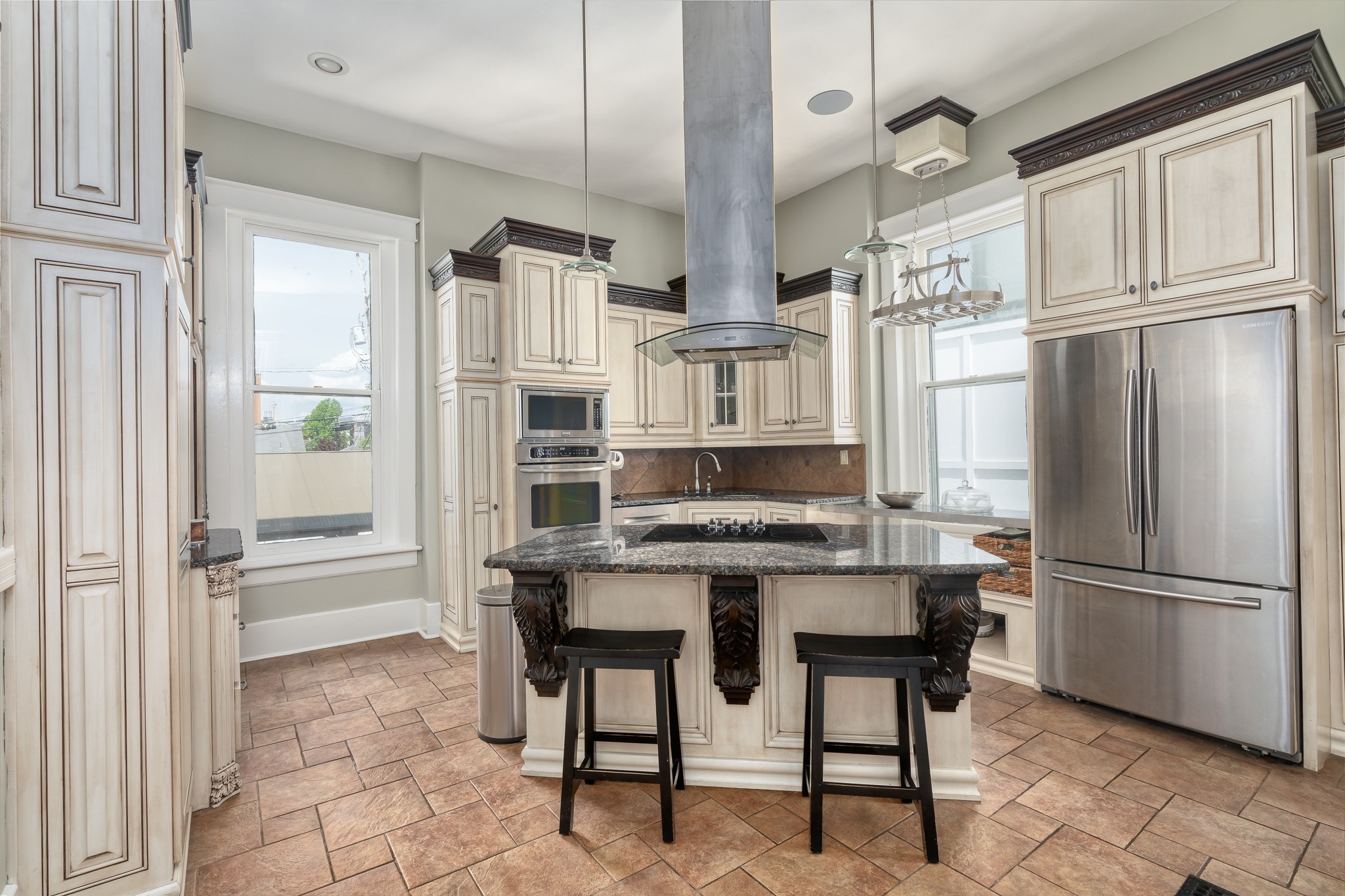 1025 Villa Place Nashville, TN 37212 - Photo 14 of 37 a kitchen with stainless steel appliances a refrigerator and a stove top oven
