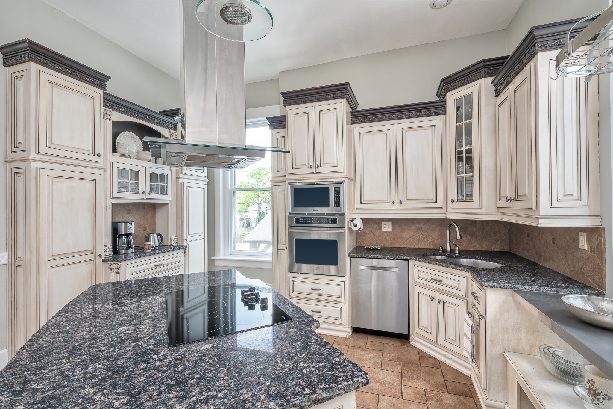 1025 Villa Place Nashville, TN 37212 - Photo 15 of 37 a kitchen with stainless steel appliances granite countertop a stove a sink and a microwave