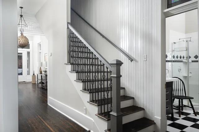 a view of entryway and hall with wooden floor