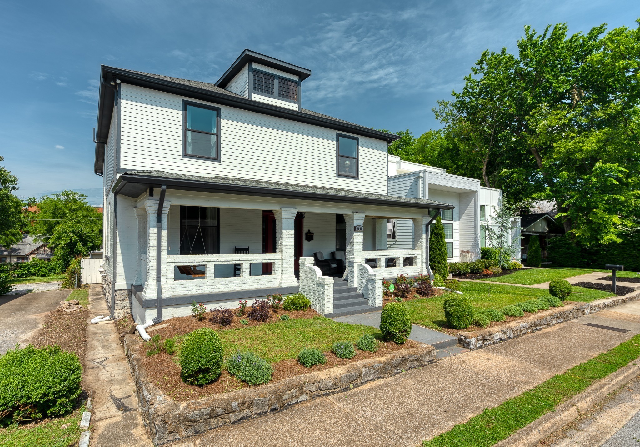 1025 Villa Place Nashville, TN 37212 - Photo 2 of 37 a front view of a house with garden and porch