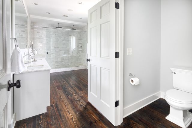 a bathroom with a shower and a toilet