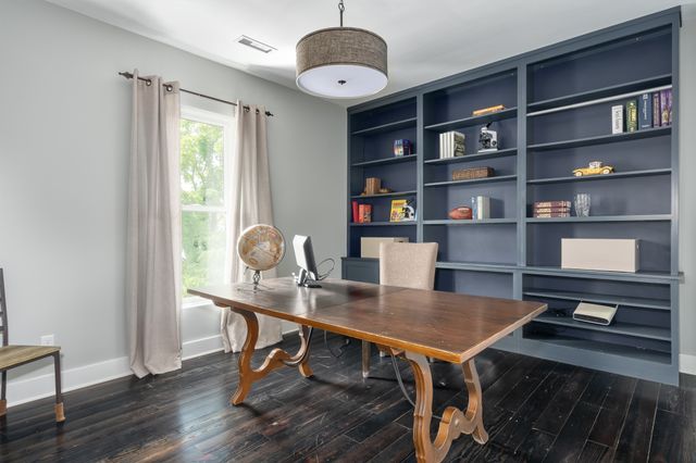 a workspace with furniture and window