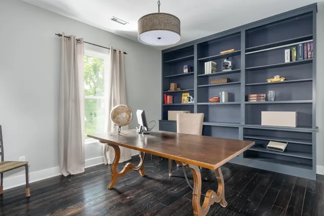 a workspace with furniture and window