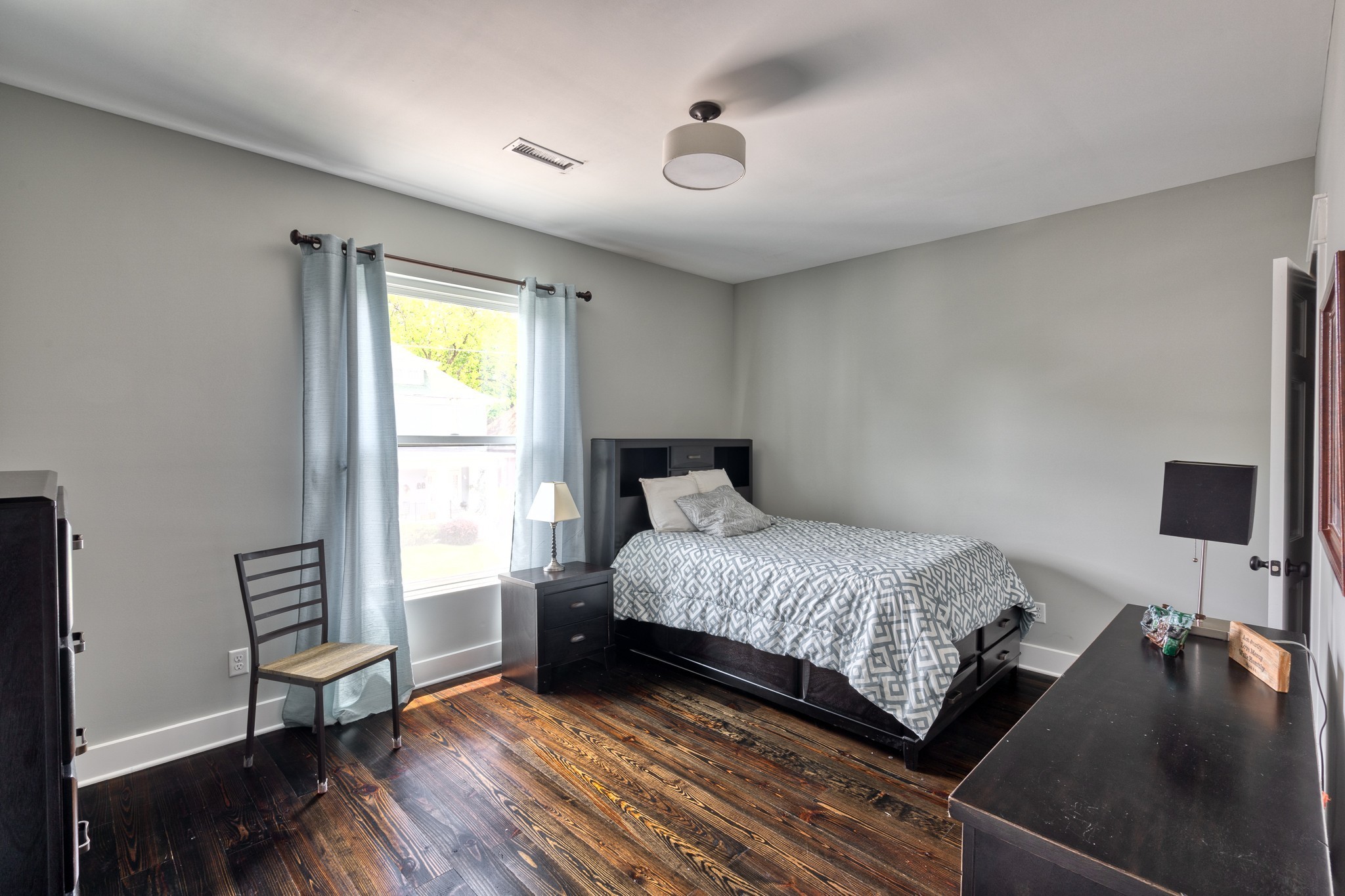 1025 Villa Place Nashville, TN 37212 - Photo 26 of 37 a bedroom with a bed and wooden floor