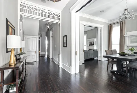 a view of a livingroom with furniture and hardwood floor