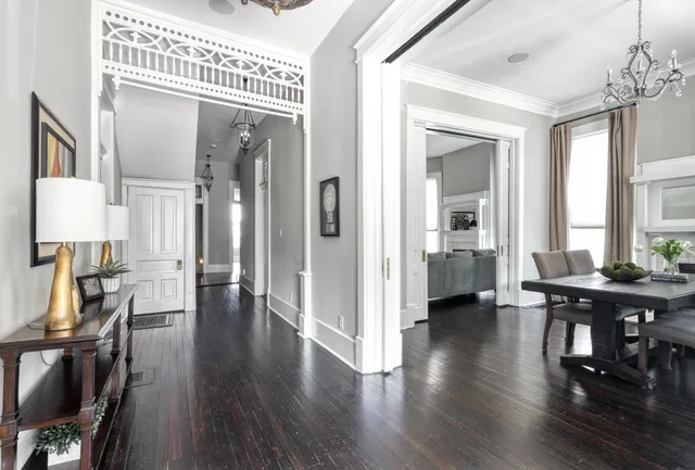 a view of a livingroom with furniture and hardwood floor