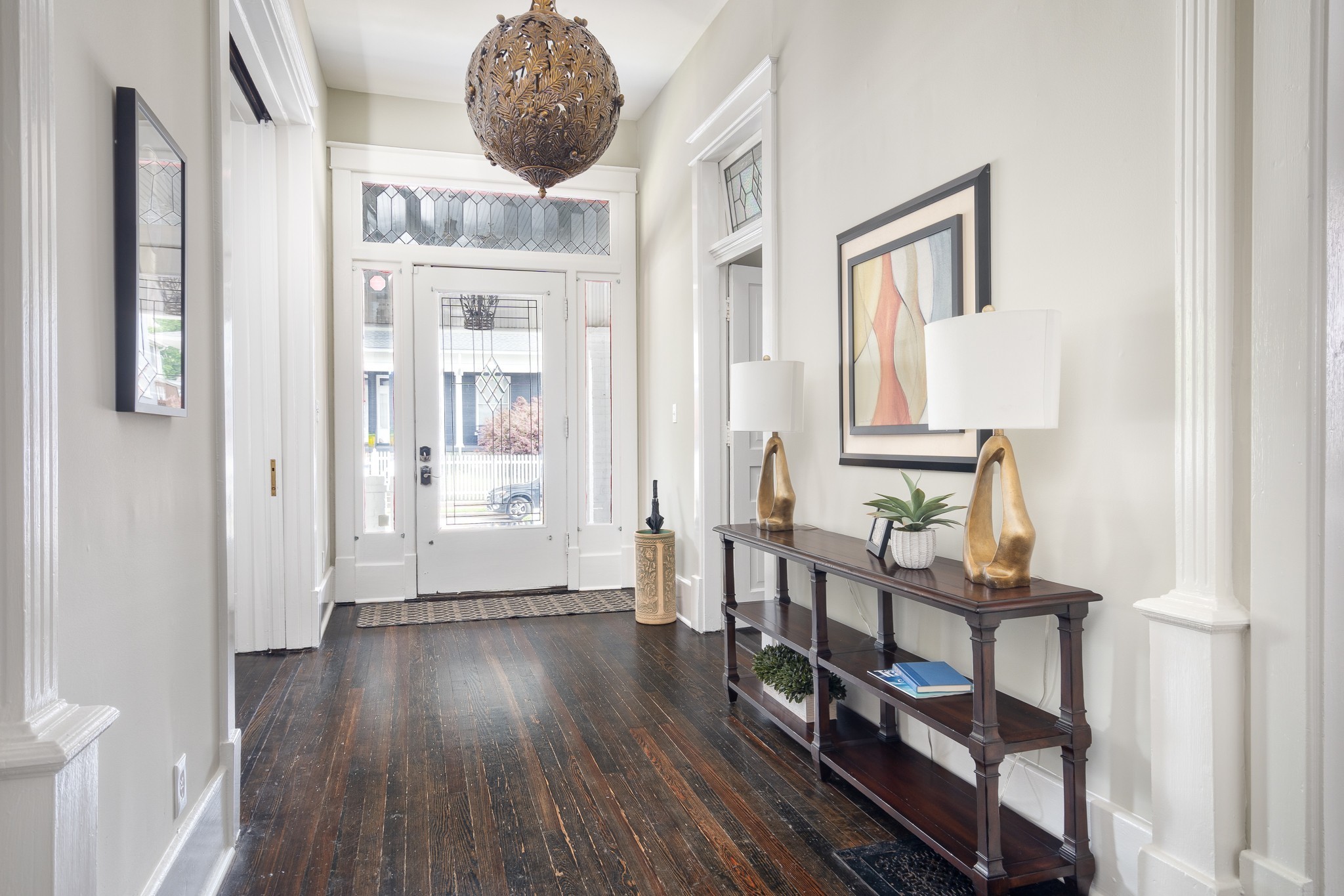 1025 Villa Place Nashville, TN 37212 - Photo 9 of 37 a very nice looking room with wooden floor and a bathroom