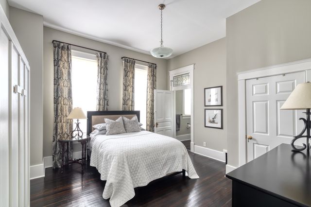 a bed room with a bed and a window