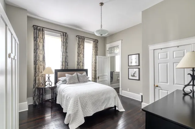 a bed room with a bed and a window