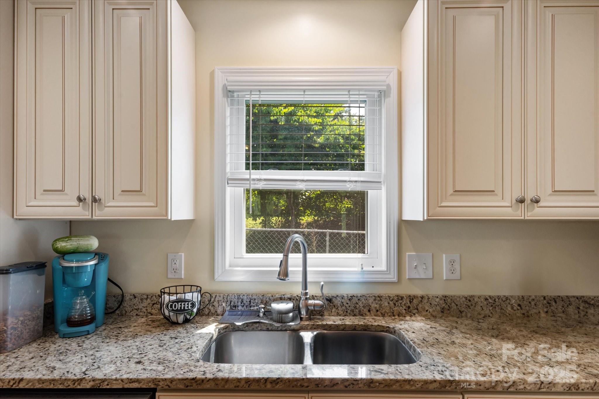 40 Alabama Avenue Marion, NC 28752 - Photo 18 of 38 a kitchen with a sink cabinets and window
