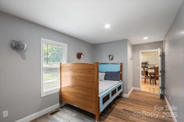 a kitchen with stainless steel appliances granite countertop cabinets and wooden floor
