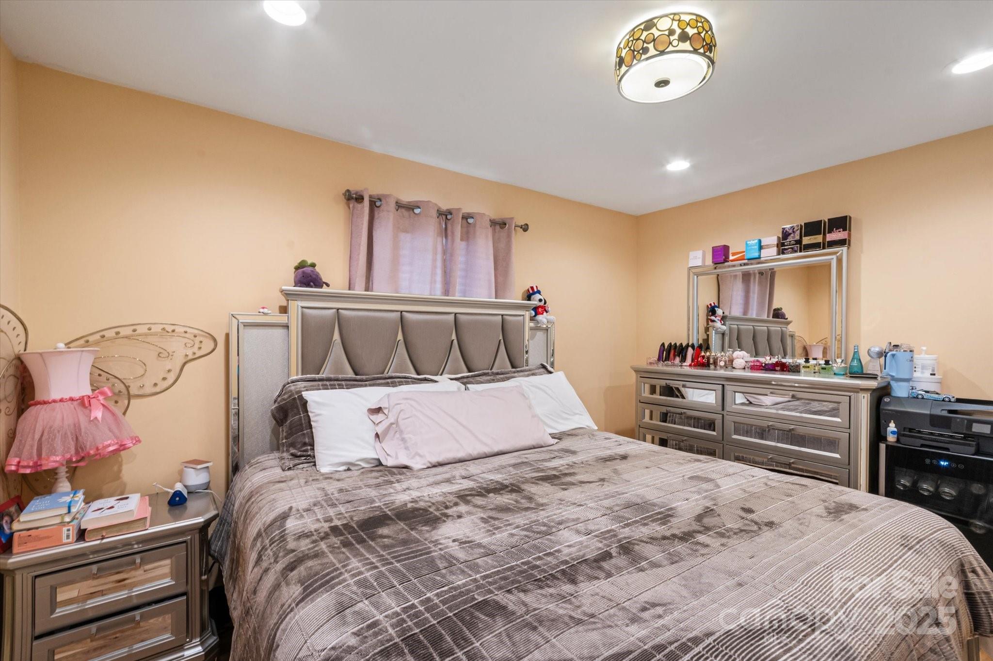 40 Alabama Avenue Marion, NC 28752 - Photo 33 of 38 a bedroom with a bed and wooden floor