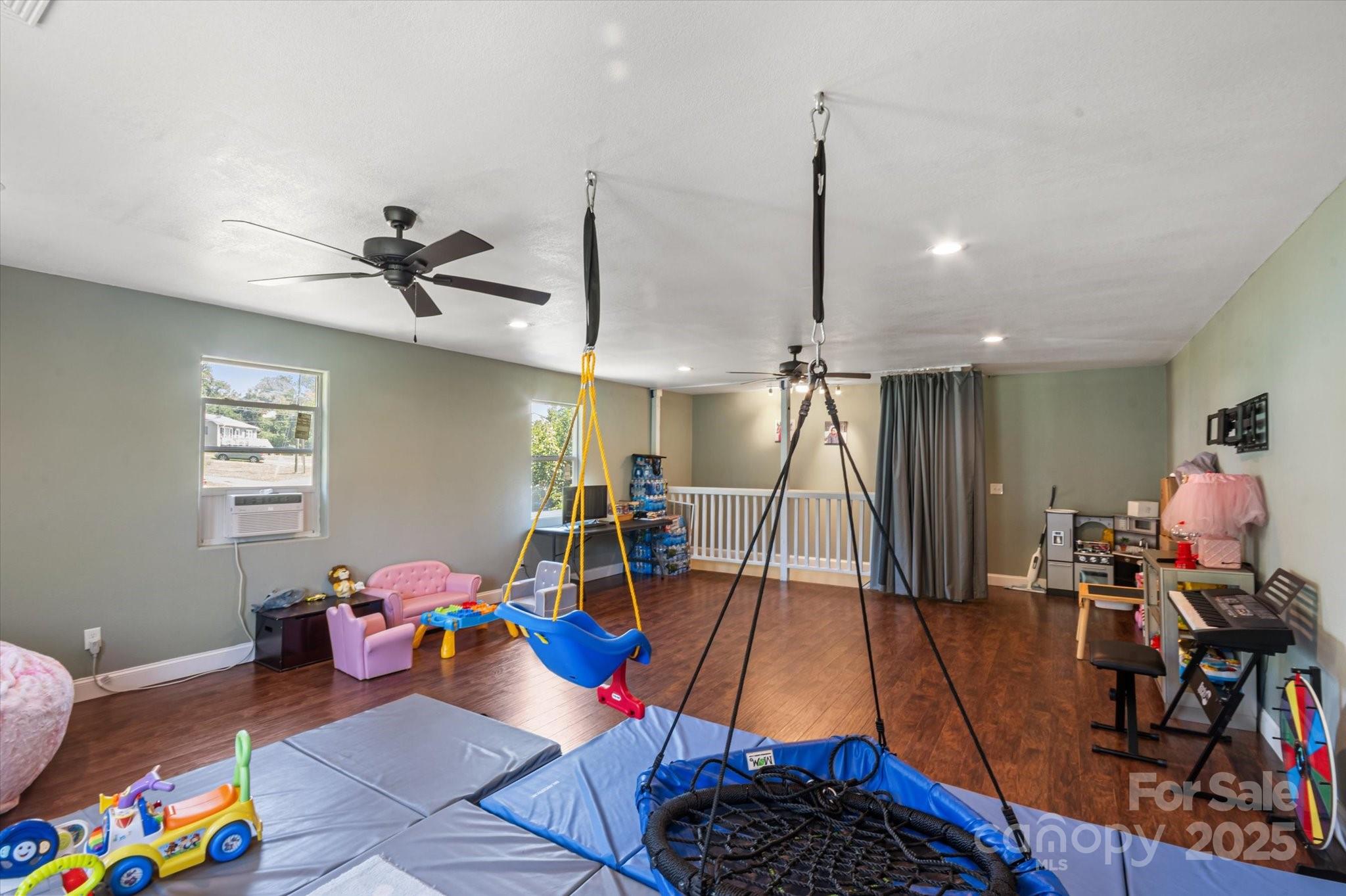 40 Alabama Avenue Marion, NC 28752 - Photo 37 of 38 a living room with furniture and a wooden floor