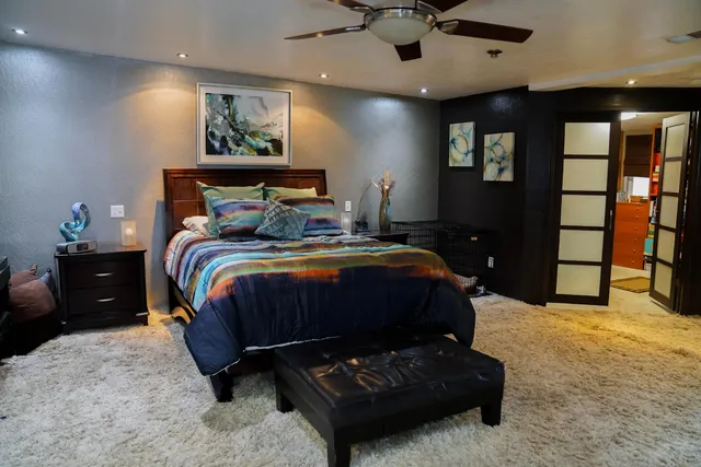a bedroom with a bed and dresser