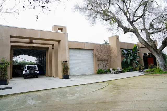 a view of a car parked in front of a house