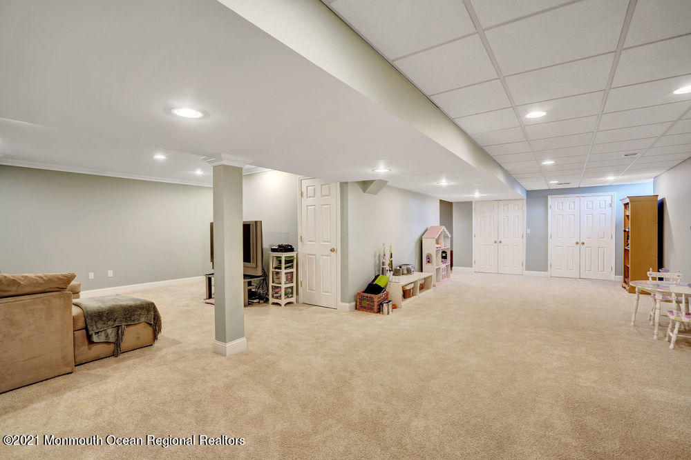 231 Pin Oak Road Freehold, NJ 07728 - Photo 50 of 74 a view of a room with gym equipment