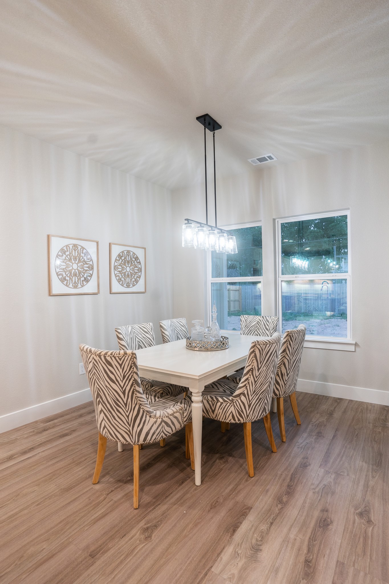 307 String Prairie Way Smithville, TX 78957 - Photo 27 of 34 a dining room with furniture a rug and wooden floor