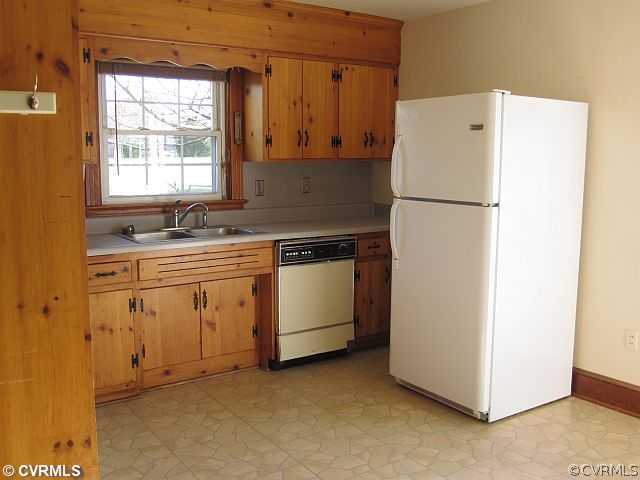 259 Crescent Road Farmville, VA 23901 - Photo 6 of 12 a utility room with cabinets washer and dryer