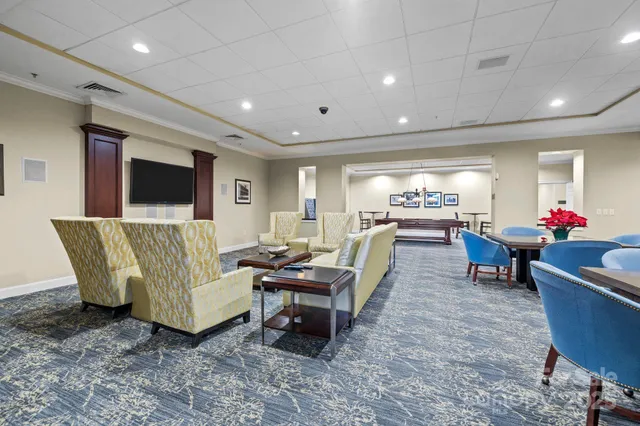 a view of a building with a dining table and chairs