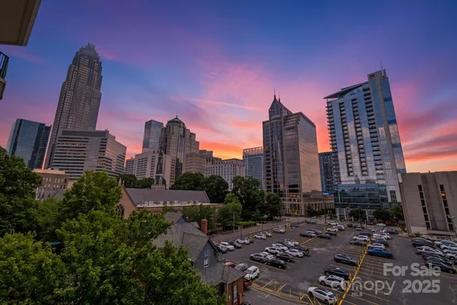 a city view with tall buildings and a street